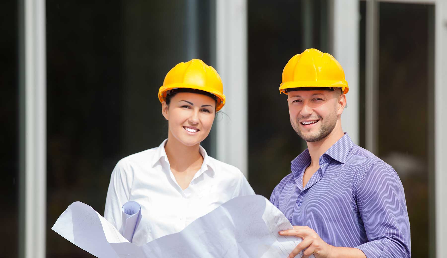 man and woman wearing hard hats